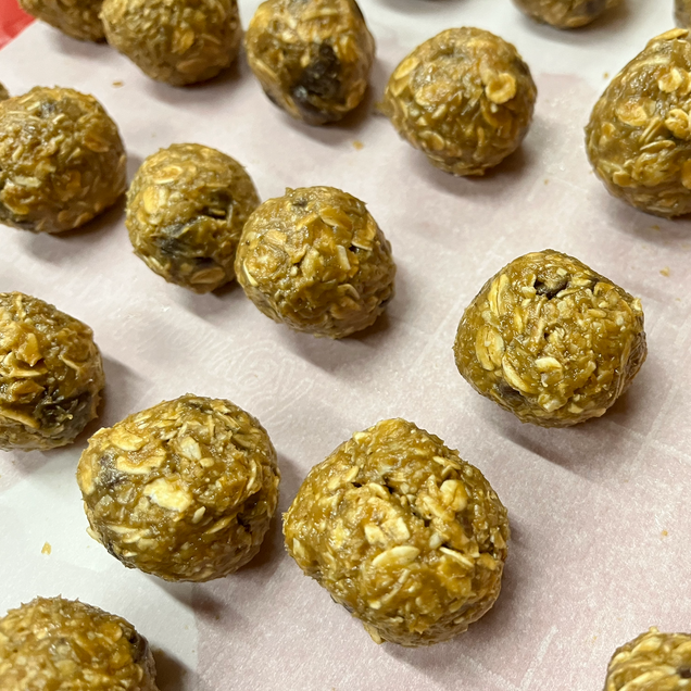 To depict the final result of energy bites recipe. The energy bites are round and have a smooth yet texturized feel and look to them.